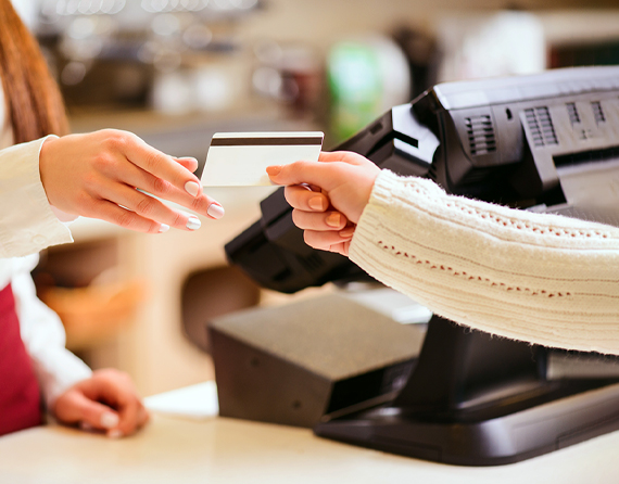 credit card being used at retail pos